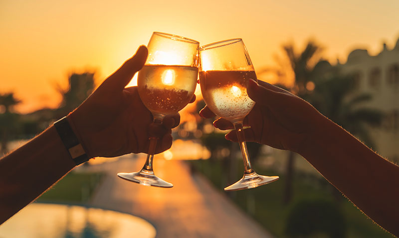 drinking wine at sunset